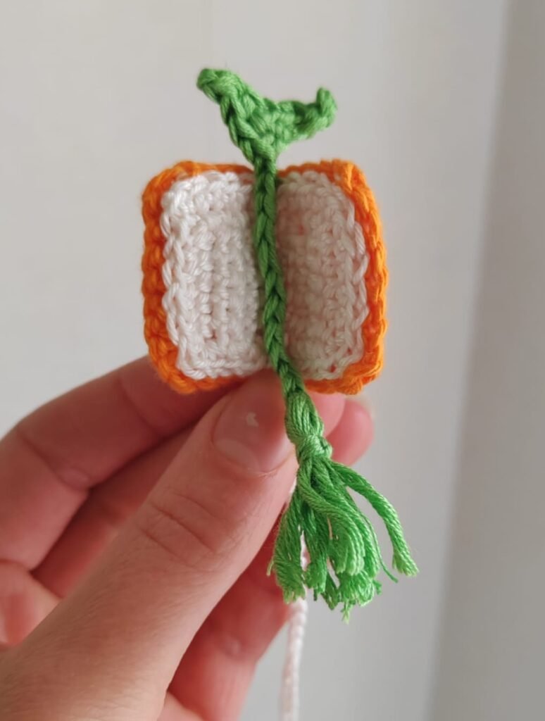 Crocheted book bookmark with a crocheted bookmark