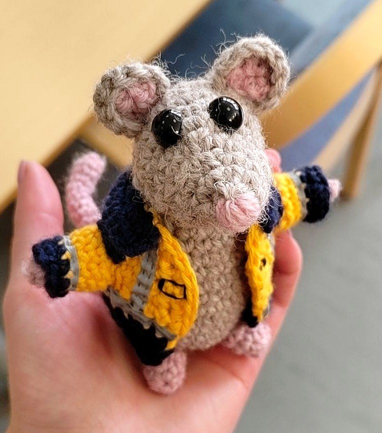 Crocheted mouse with a crocheted working jacket