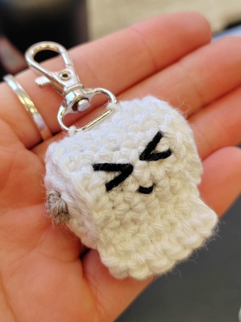 Crocheted toilet paper keychain